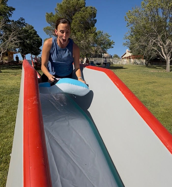 A rider sliding down a Swole Slide